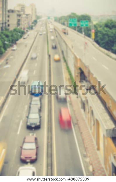 Blurred image of cars on high way. Transportation\
background. Aerial\
view.