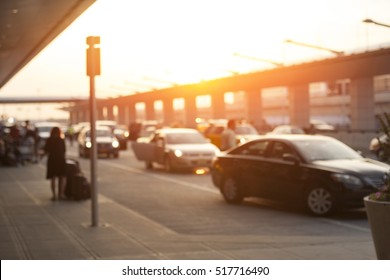 Blurred image of cars waiting in LAX Los Angeles international airport arrivals terminal taxi lane, an uber, taxify or lyft pick up location.