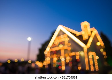 Blurred Image Of Christmas Lights Outside On A House.