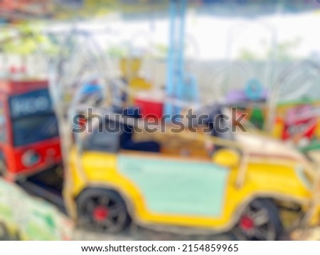 blurred image of Close up a traditional Indonesian kiddie ride called 