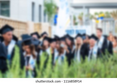 Blurred image College students at Graduation Ceremony.Group happy multiple races students in mortar boards and bachelor gowns outdor. - Shutterstock ID 1116858914