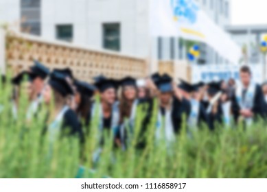 Blurred image College students at Graduation Ceremony.Group happy multiple races students in mortar boards and bachelor gowns outdor. - Shutterstock ID 1116858917
