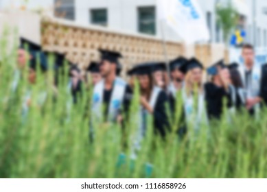 Blurred image College students at Graduation Ceremony.Group happy multiple races students in mortar boards and bachelor gowns outdor. - Shutterstock ID 1116858926