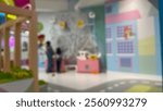 Blurred image of a colorful indoor play area, conveying a sense of movement and activity Defocused, out of focus, blurred or bokeh background suitable for advertising or advertising media