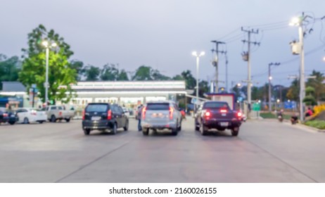 Blurred Image Of A Convenience Store Parking Lot In The Evening