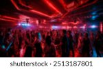 Blurred image of a crowded nightclub, filled with people dancing under neon lights and colorful lighting, creating a vibrant nightlife atmosphere