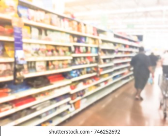 Blurred Image Customers Stock Up Candy, Chewy And Gummy Goodness For Holiday Season. Crowed Of People Buying Multipacks, Variety Packs, Chocolate, Hard Candies, Bars, Sour At Grocery Store In America