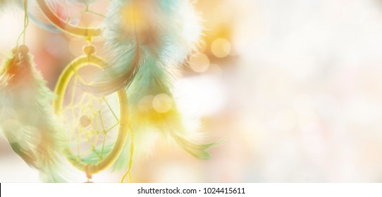 Blurred image, dream catcher native american in the wind with sunlight and blurred bokeh for dream and hope concept background
