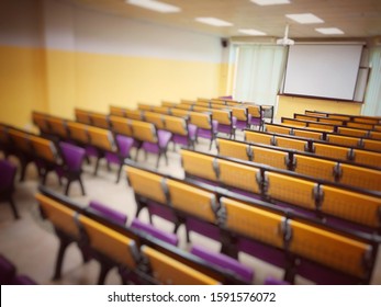 Blurred image of Empty classroom, college lecture hall  preparing for education in university, conference room before meeting. Business meeting room or Board room interiors. vintage tone.