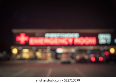 Blurred Image Exterior Emergency Room With Neon Led Sign Illuminated At Night In Houston, Texas, US. Facade Of Emergency Department Neon Shining Signboard. Healthcare Service Concept. Vintage Filter.