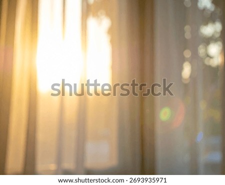 A blurred image features soft light shining through a window with sheer curtains creating a dreamy and airy atmosphere.