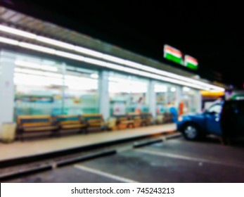 Blurred Image In The Front Of The Convenience Store At Night.