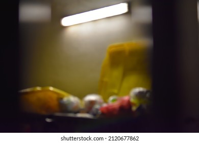 Blurred Image Of Garbage And Lamp At Night