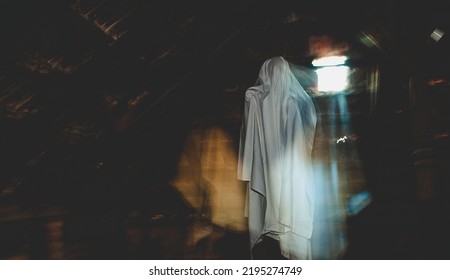 blurred image of ghost in the attic haunted house for Halloween