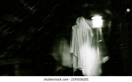 blurred image of ghost in the attic haunted house for Halloween