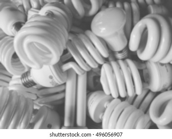 Blurred Image Of Group Of Light Bulbs. Light Bulb Background. Black And White Image.