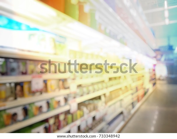 blurred image of hardware\
store and retails store interior for background. vintage tone with\
light effect.