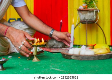 Blurred image of Hindu priest lighting up holy fire or holy light for worshipping idol of God Jagannath, Balaram and Suvodra. Ratha jatra festival is Hindu festival in India. Howrah, WB, India.