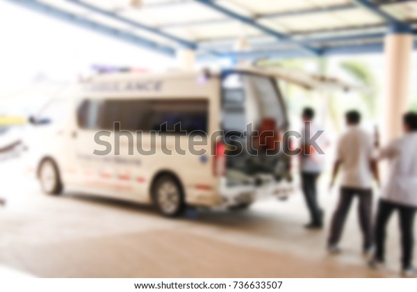 blurred image of hospital, medical worker\
moving patient on gurney take to the\
emergency.