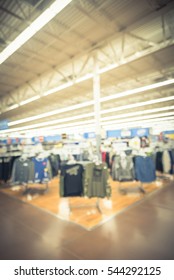 Blurred Image Huge Variety Of Menswear At Men Clothing Department In Modern Department Retailer Store. Defocused Supermarket Interior Aisle And Row. Inventory, Logistic, Export Concept. Vintage Tone.