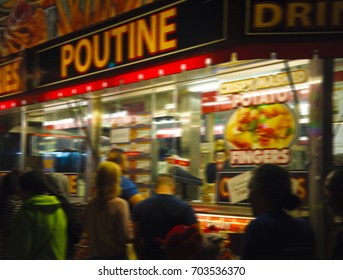 Blurred Image Of Hungry Customers Gathering At A Late Night Food Truck