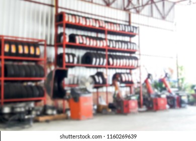 Blurred Image Inside The Tire Shop.