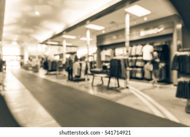 Blurred Image Interior Of Sports And Fitness Clothing Store In America. Sport Shop With Famous Sports Fashion Brand Worldwide Of Athletic Shoes, Gear, Apparel. Healthy Lifestyle Concept. Vintage Tone.