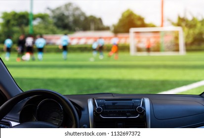 Blurred Image Of Kids Soccer Game Look From The Front Window Of The Car 