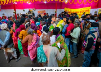 Blurred image of Kolkata, West Bengal, India. Hindu devotees with families queing up for roti, Indian food, at Gangasagar transit camp, Outtram ghat, Kolkata.