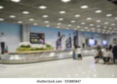 Blurred Image Of Luggage Carousel At Baggage Claim In Airport