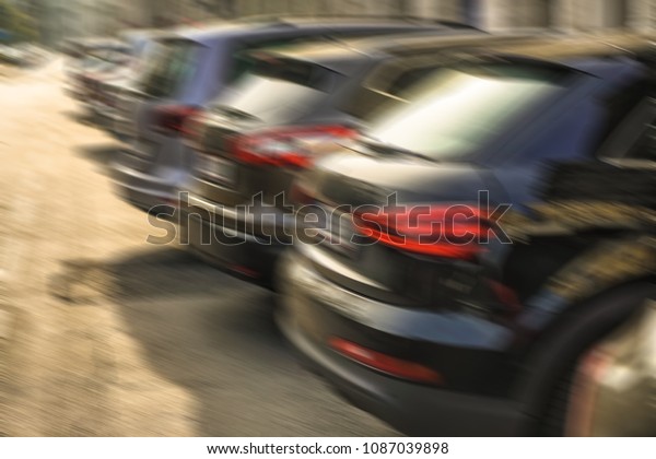 blurred image of luxury\
modern Cars For Sale Stock Lot Row. Car Dealer Inventory. Cars For\
Sale Stock Lot Row. Car Dealer Inventory. sunset sun rays light.\
sun beam