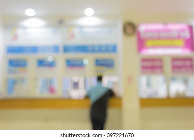 Blurred Image Of A Man At Bus Station Counter