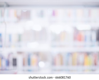 Blurred Image Of Many Books On Bookshelf In Library Background.