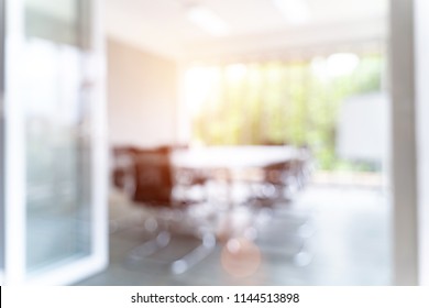 Blurred Image Of Meeting Room In The Modern Office, Evening Time With Sunlight - Ideal For Presentation Background.