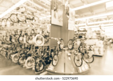 Blurred image multiple rows of kid bikes hanging on rack at department store in Humble, Texas, US. Various bright color bicycles for kid in bike shop. Active lifestyle concept background, vintage tone - Powered by Shutterstock