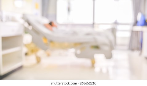 Blurred Image Of Patient With Drip In Hospital For Background Usage.