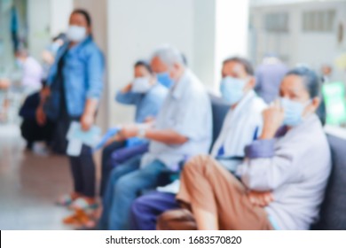 Blurred  image of patients in the hospital waiting to see doctor for  check and test Coronavirus disease,Covid 19 before treatment.