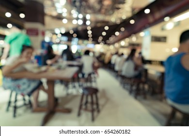 Blurred image of peolple in cafeteria for background usage