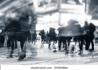 Blurred Image Of People Moving In Crowded Night City Street. Art Toning Abstract Urban Background. Hong Kong