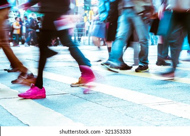 Blurred Image Of People Moving In Crowded City Street. Art Toning Abstract Urban Background. Hong Kong