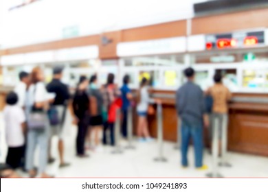 Blurred Image Of People Queuing For Hospital Services.