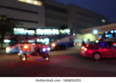 Blurred Image Of People Wait For Bus Inside Bus Terminal For Long Holiday, New Year Festival In Night Time For Come Back To See Their Family. They Carry Passenger's Goods And Luggage.