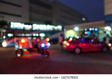 Blurred Image Of People Wait For Bus Inside Bus Terminal For Long Holiday, New Year Festival In Night Time For Come Back To See Their Family. They Carry Passenger's Goods And Luggage.