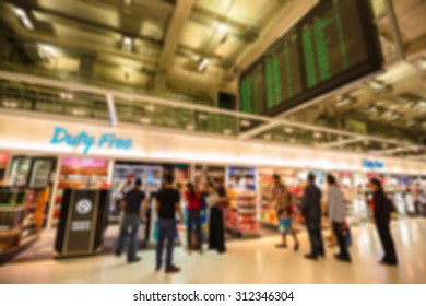 Blurred Image People Walking And Shopping In Duty Free Airport 