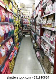 Blurred Image Of Pet Food Bag Store Shelves.