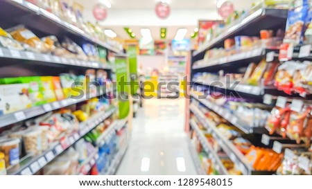 Blurred image of product shelves in convenience stores.