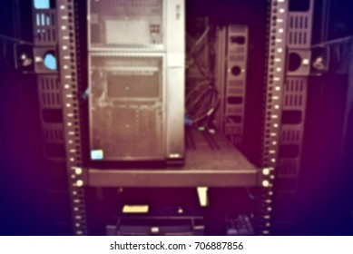 blurred image of severs computer in a rack at the large data center.