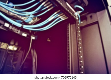 blurred image of severs computer in a rack at the large data center.