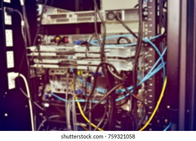 blurred image of severs computer in a rack at the large data center.