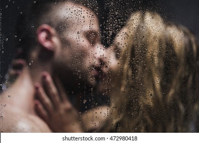 Blurred Image Of A Sexy Pair Kissing In The Shower